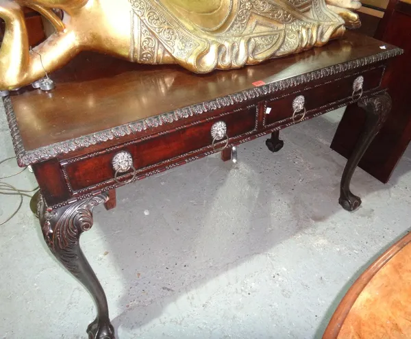 A 19th century mahogany rectangular two drawer table on ball and claw feet.