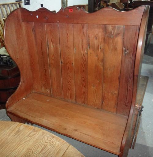A pine high back settle.