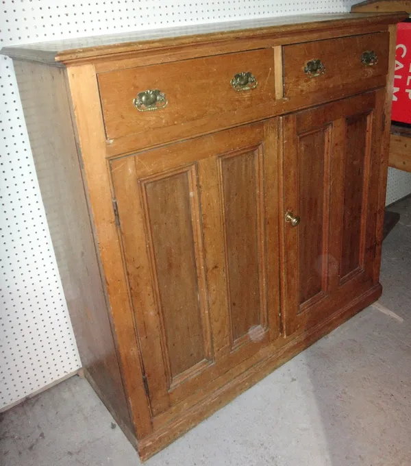 An early 20th century pine side cupboard.