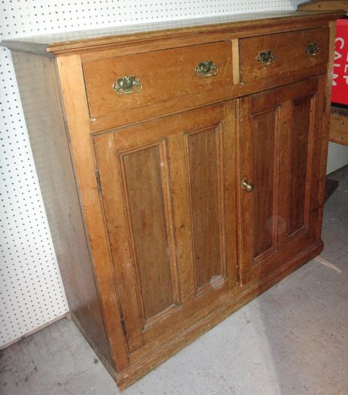 An early 20th century pine side cupboard.
