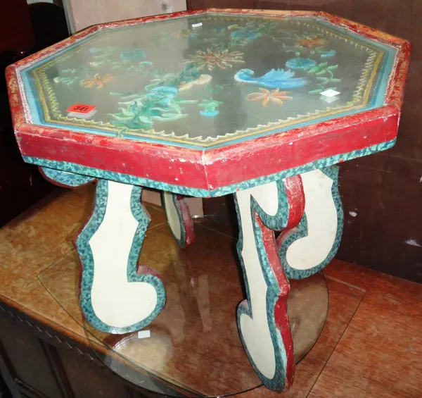 An octagonal occasional table with painted decoration and mirrored top.