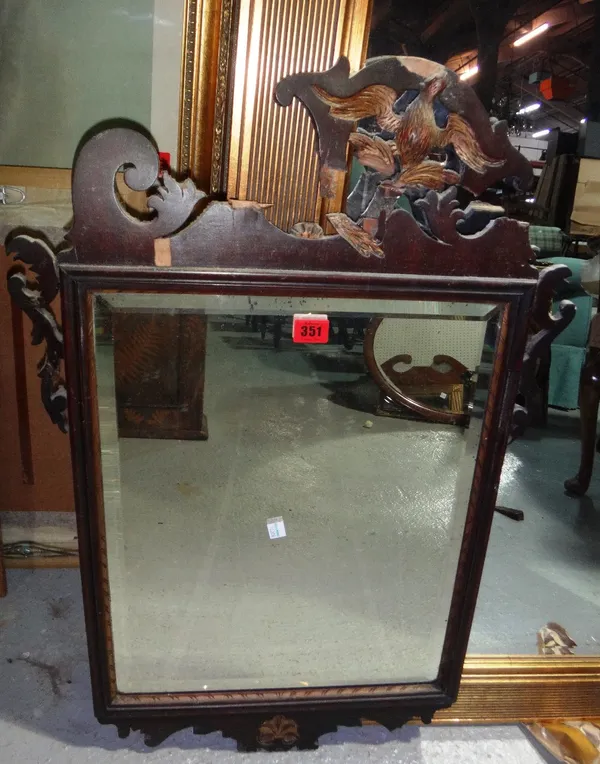 An 18th century fret cut pier mirror with ho ho bird surmount.