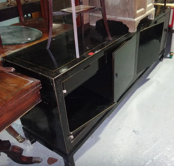 A 20th century black lacquer gilt highlighted four door sideboard on block feet, 200cm wide.