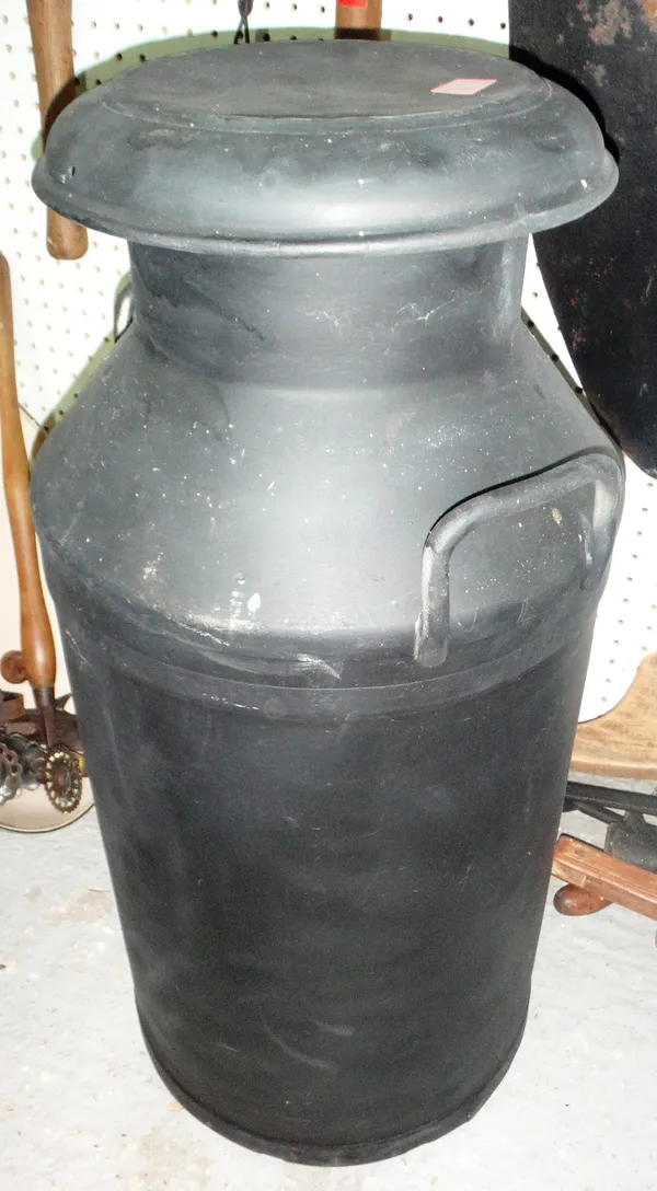 A black painted milk churn.