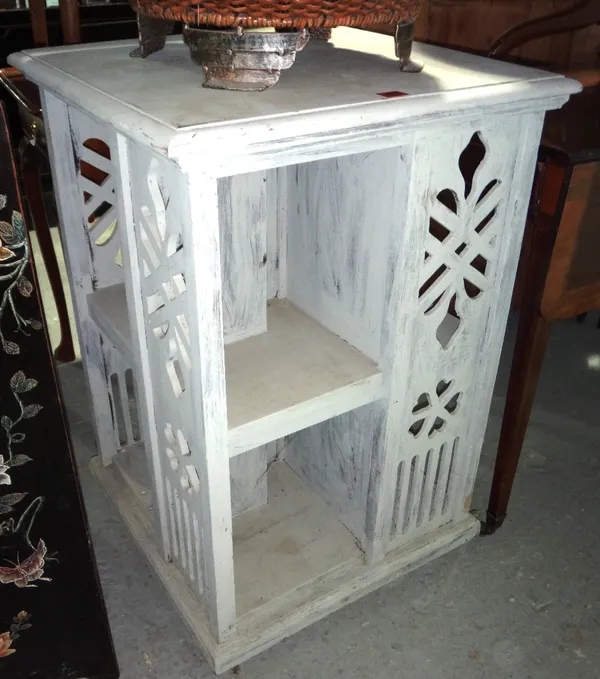 A white painted revolving bookcase.