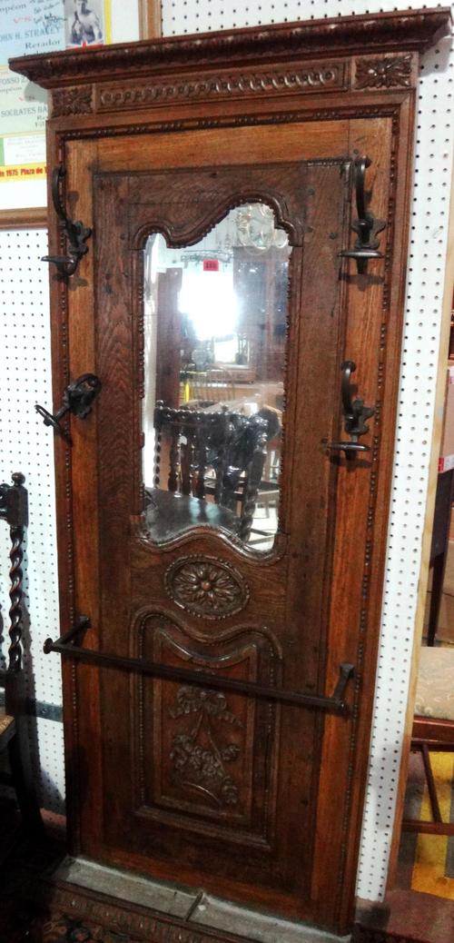 A made up carved oak hall stand with mirrored back.