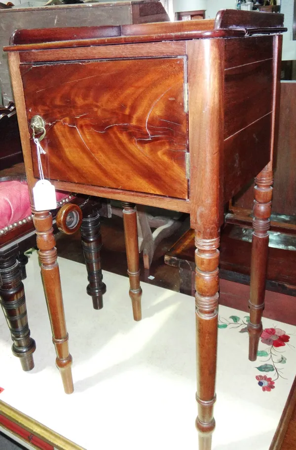 An early 19th century pot cupboard on turned supports.