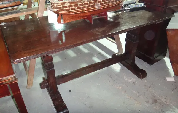 A 19th century oak trestle type rectangular dining table.