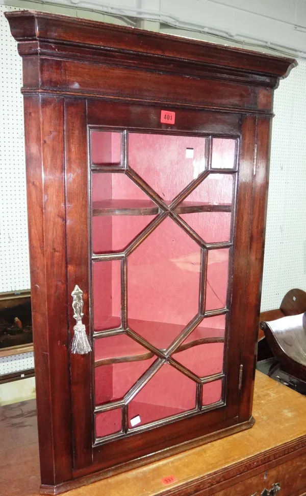 A glazed mahogany hanging corner cabinet.