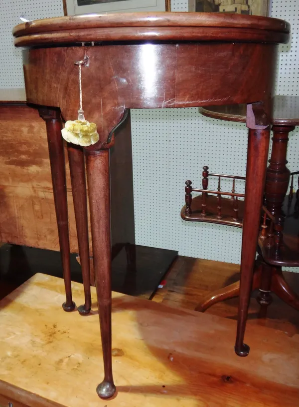 A 19th century mahogany small foldover tea table.