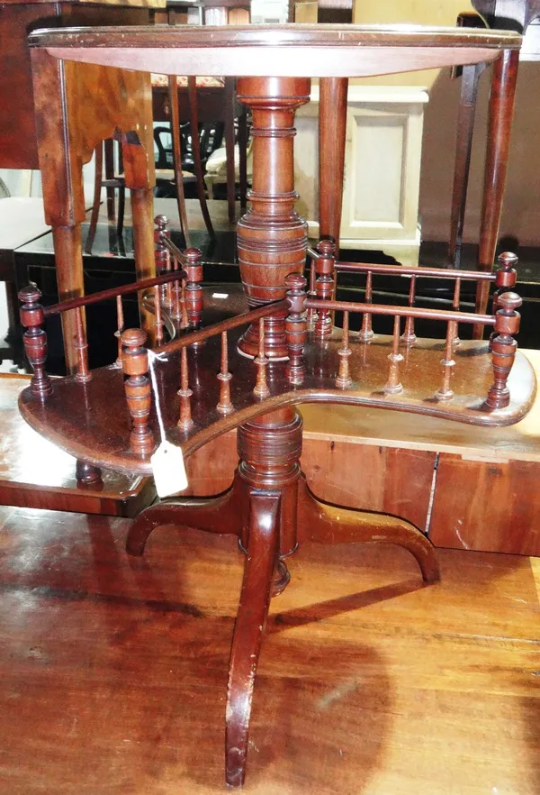 A 19th century mahogany circular occasional table with revolving undertier.