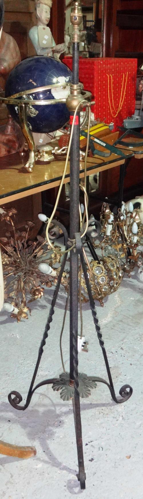 A 20th century wrought iron and brass adjustable standard lamp.