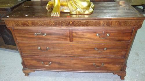A 19th century mahogany mule chest in the form of a chest of two short and two long drawers.