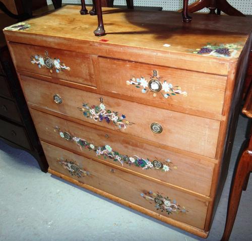 A pine chest of two short and three long drawers.