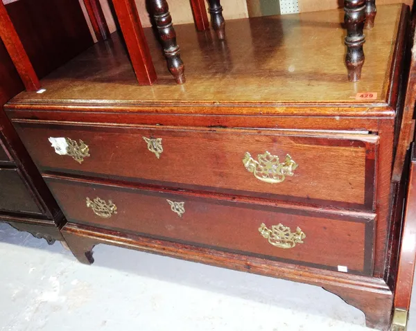 A low oak chest of two long drawers.