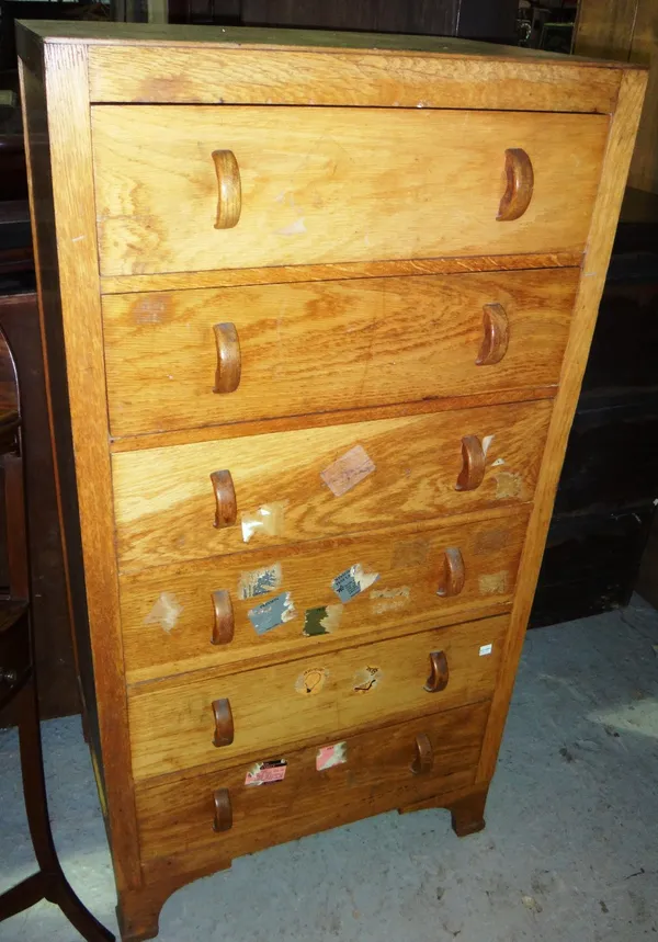 A 20th century tall oak chest of six drawers.