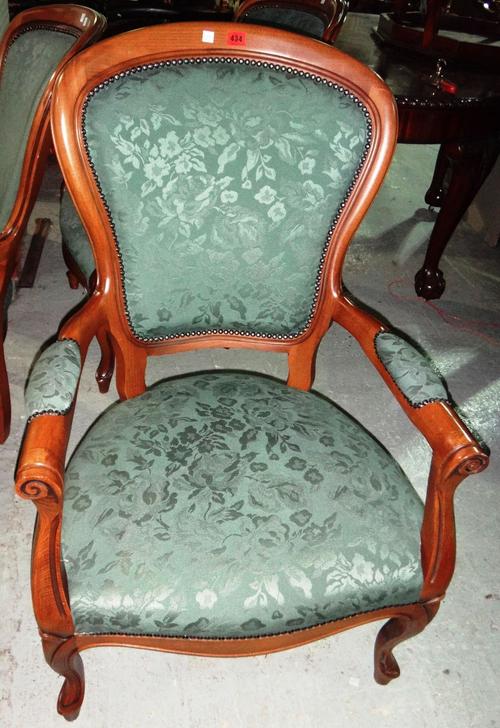 A set of four modern high back armchairs.