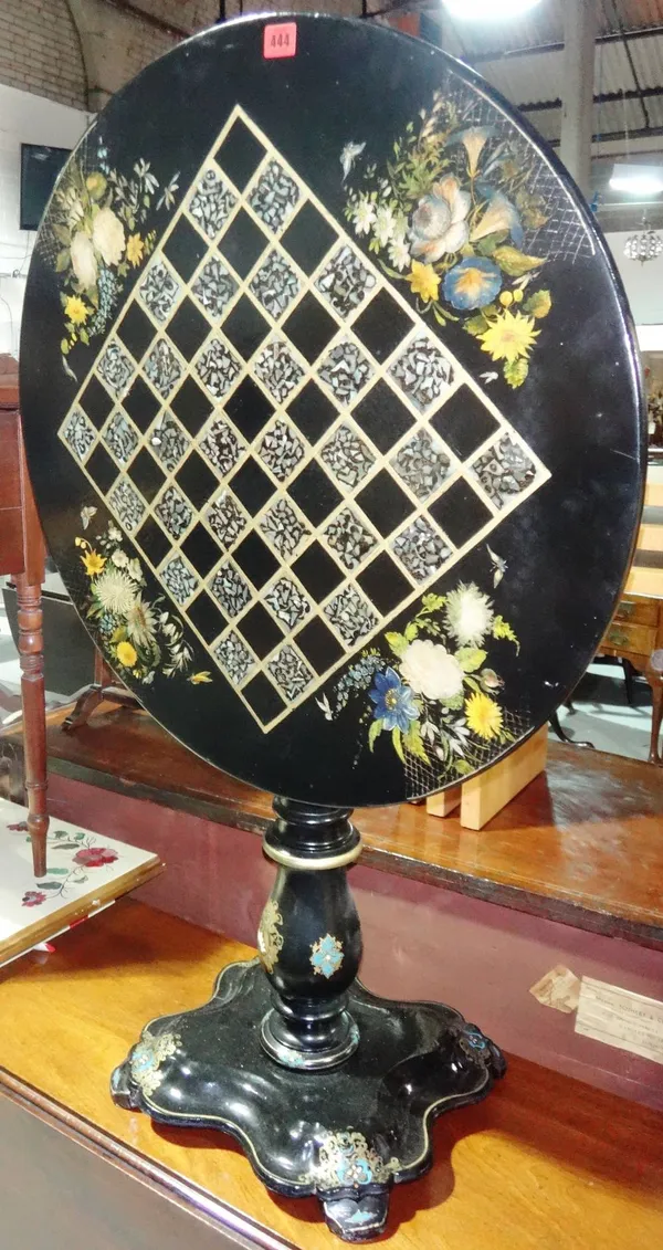 A 19th century black lacquer and painted tilt top occasional table.