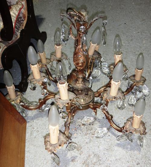 A gilt metal and glass twelve light chandelier.