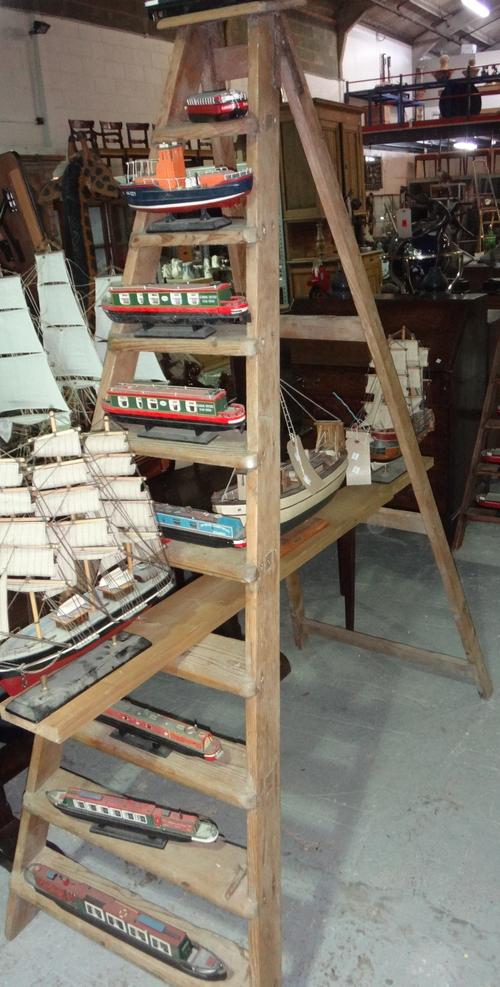 An early 20th century pine ladder and another (2).