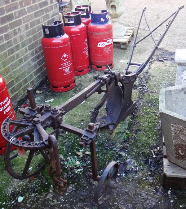An early 19th century wrought and cast iron plough.