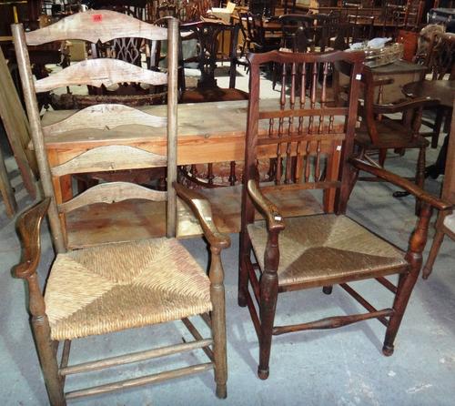 A ladder back open armchair, together with a spindle back scullery open armchair.