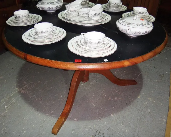 A 20th century circular pine pedestal table.