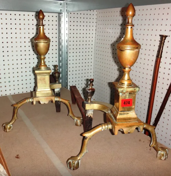 A pair of brass andirons.