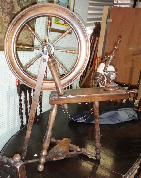 A 20th century walnut spinning wheel.