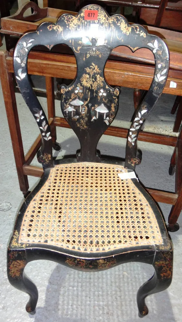 A Victorian black lacquer and papier mache nursing chair.