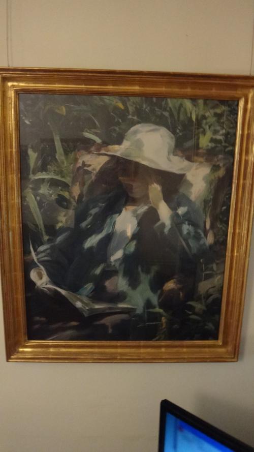 A 20th century ebonised and gilt circular tripod table.