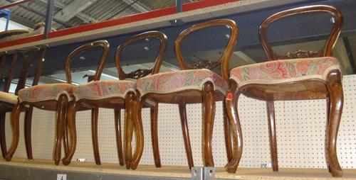 A set of four 19th century mahogany balloon back dining chairs.