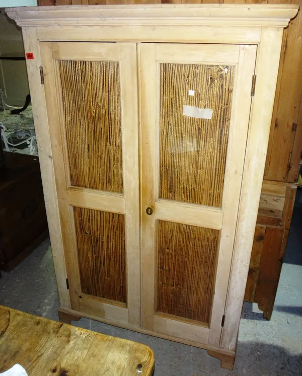 A 19th century pine two door glazed cabinet.