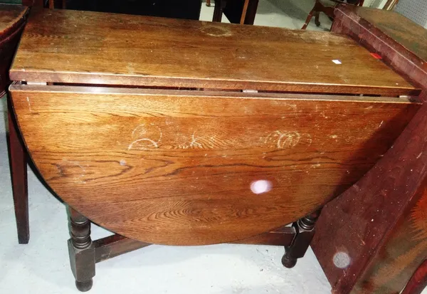 A 20th century oak drop flap table