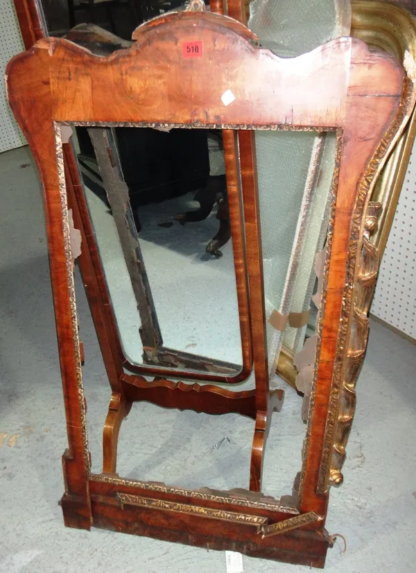 An 18th century style parcel gilt walnut mirror frame. (a.f)