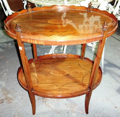 A late 19th century marquetry inlaid satinwood and mahogany oval two tier etagere on splayed supports, 65cm wide.