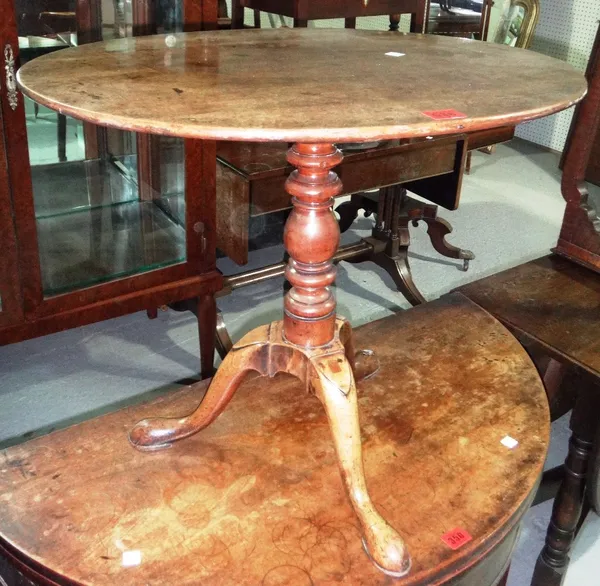 A 19th century mahogany oval snap top table.