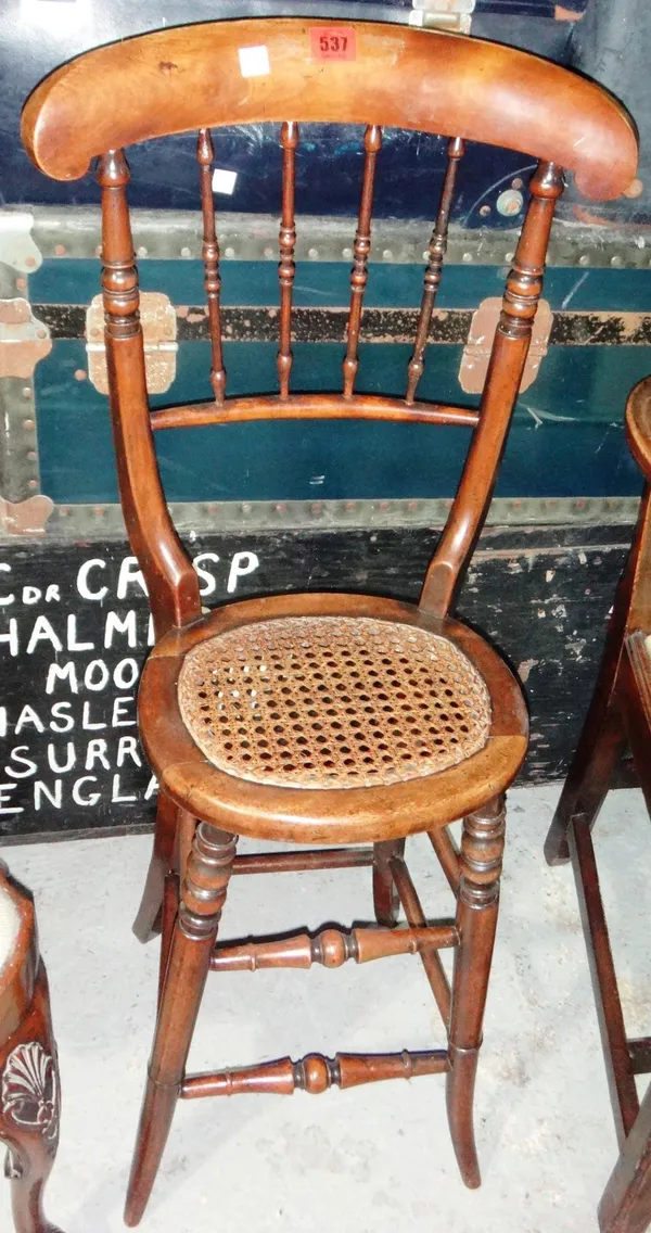 A 19th century walnut framed cellists chair.