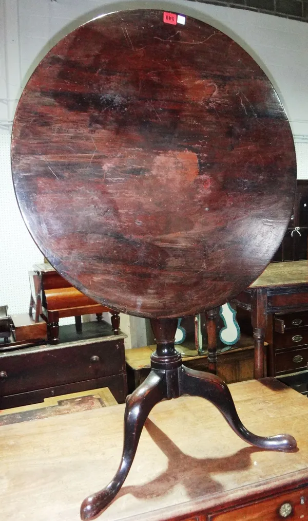 A 19th century mahogany circular tripod snap top table.