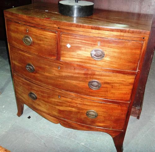 A 19th century mahogany bowfront chest of two short and two long drawers.