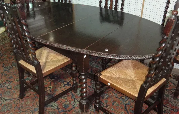 A 20th century oak drop flap extending dining table.