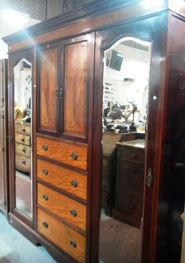 A 19th century mahogany triple compactum wardrobe.