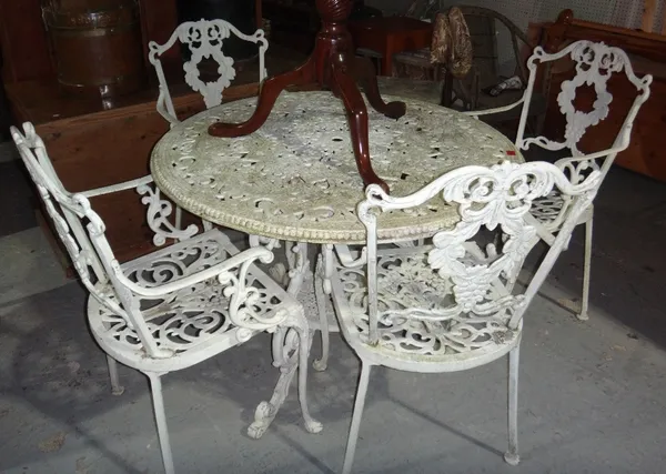 A 20th century white painted aluminium garden table and four chairs.
