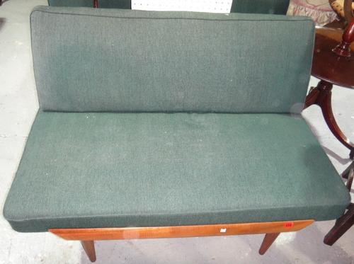 A pair of 1960's Danish teak framed sofas and a Finn Juhl style coffee table.