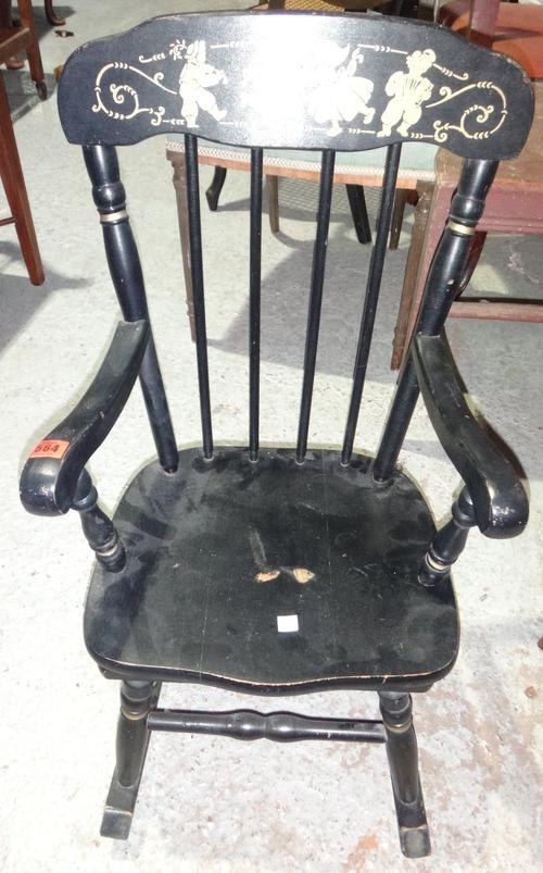 An ebonised child's rocking chair, together with a mahogany rectangular footstool.