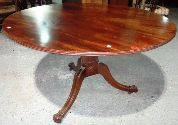 A George IV mahogany circular mahogany snap top breakfast table.