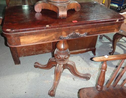 A 19th century rosewood foldover card table.