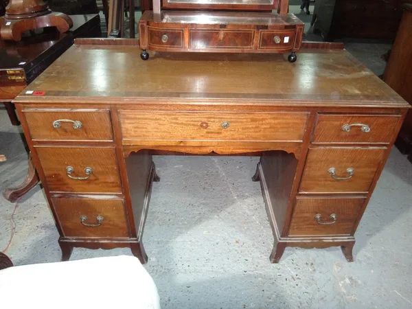 A 20th century mahogany kneehole desk.