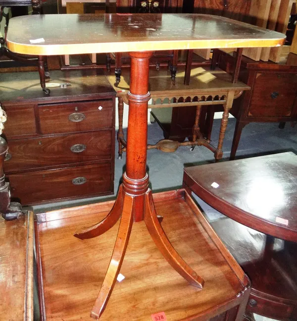 A 20th century mahogany rectangular tripod table.