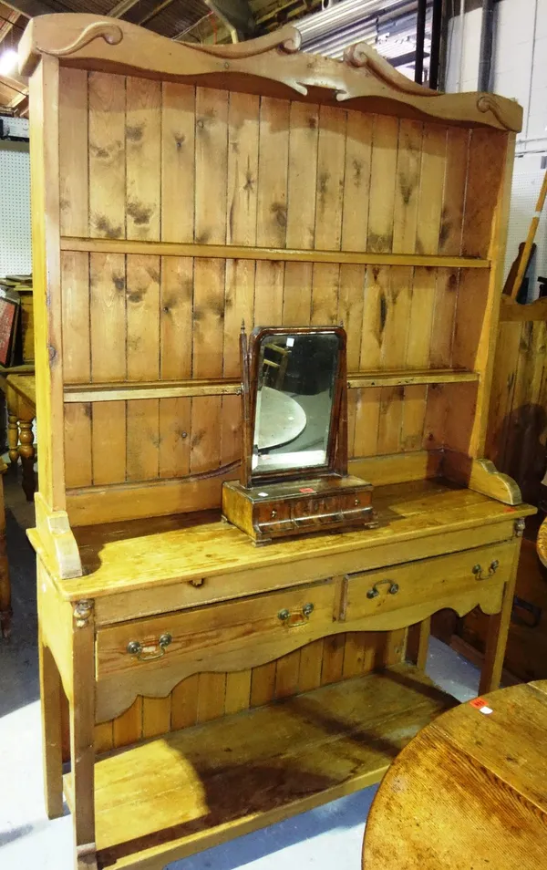 A 19th century pine kitchen dresser with a two tier plate rack and pot board undertier.